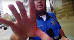 This is a still of Officer Glenn Szelest as he grabbed at my cell cam in an attempt to illegally bar me from filming him as he violated citizen's civil rights and illegally exceeded his authority. This was the incident that introduced me to Adam Rupeka, who helped me deal with the crooked legal system in this case. 